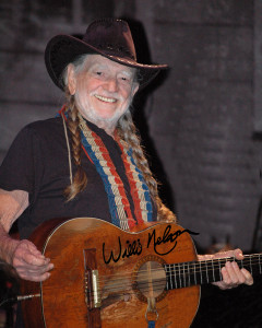 Photo of Willie Nelson and his guitar named "Trigger" taken during the Jamey Johnson tribute to Hank Cochran at the Ryman Auditorium in Nashville, TN.